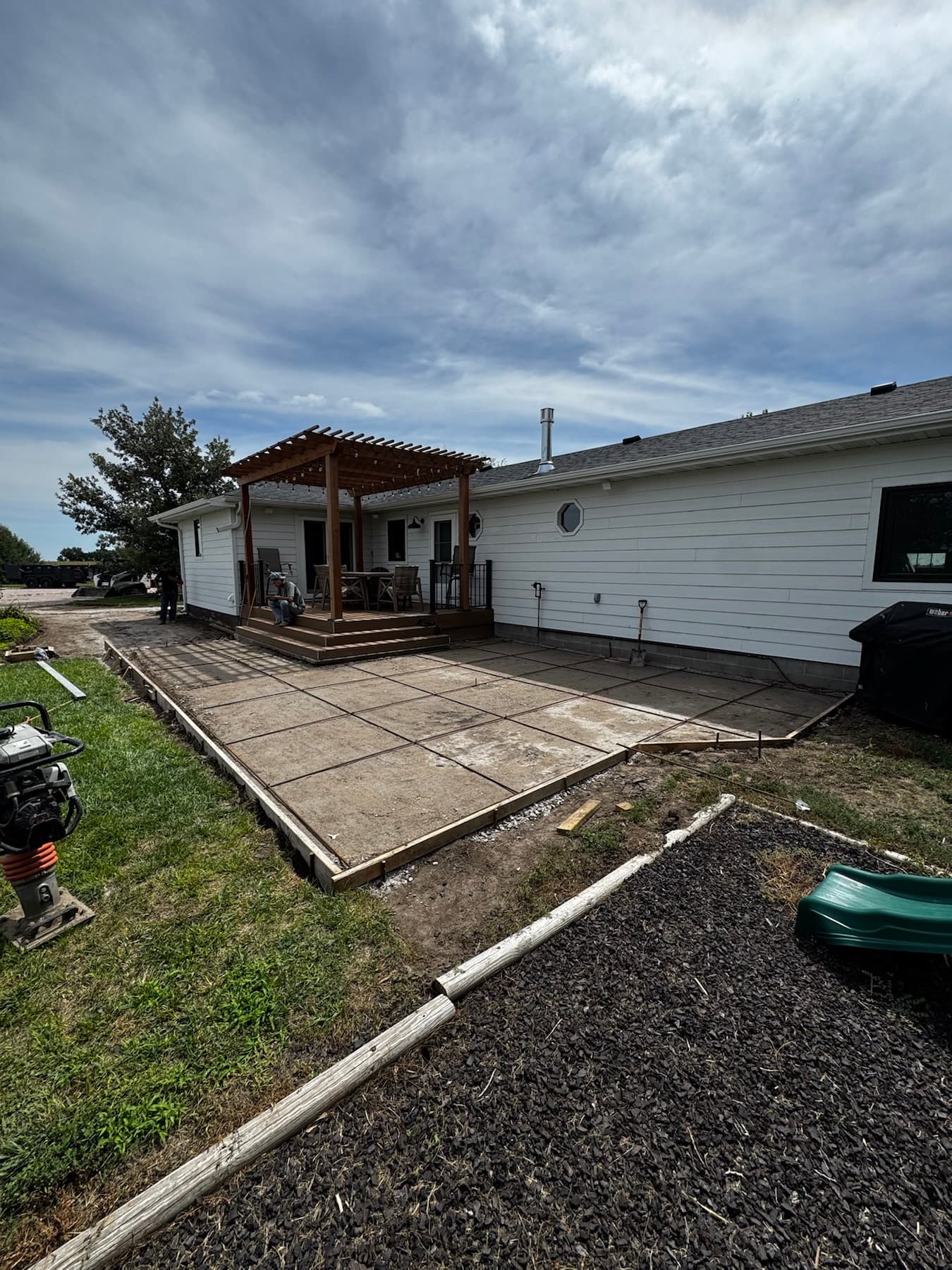 Finished concrete patio behind a home